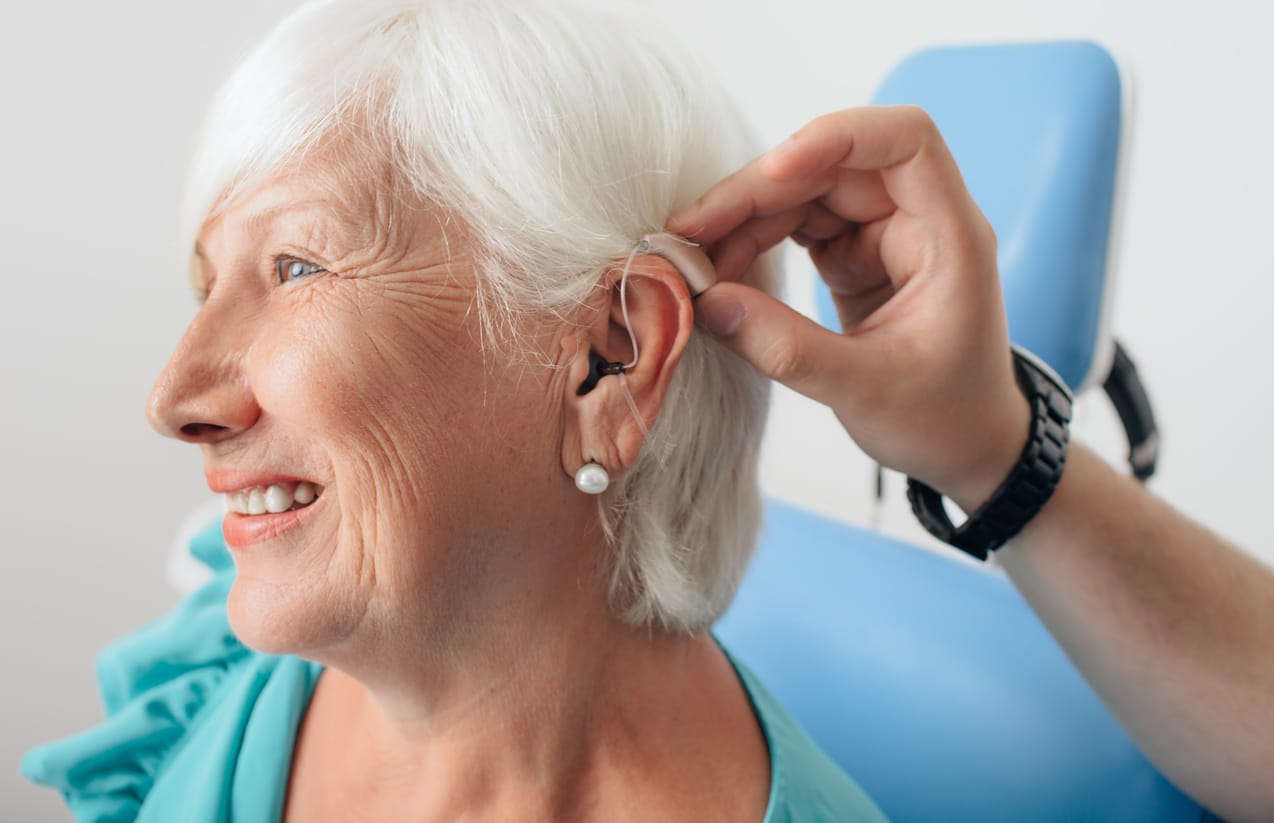 adjusting of a hearing aid for an aged woman