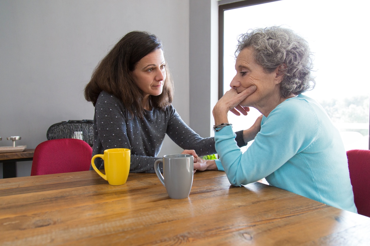 woman consoling upset mother