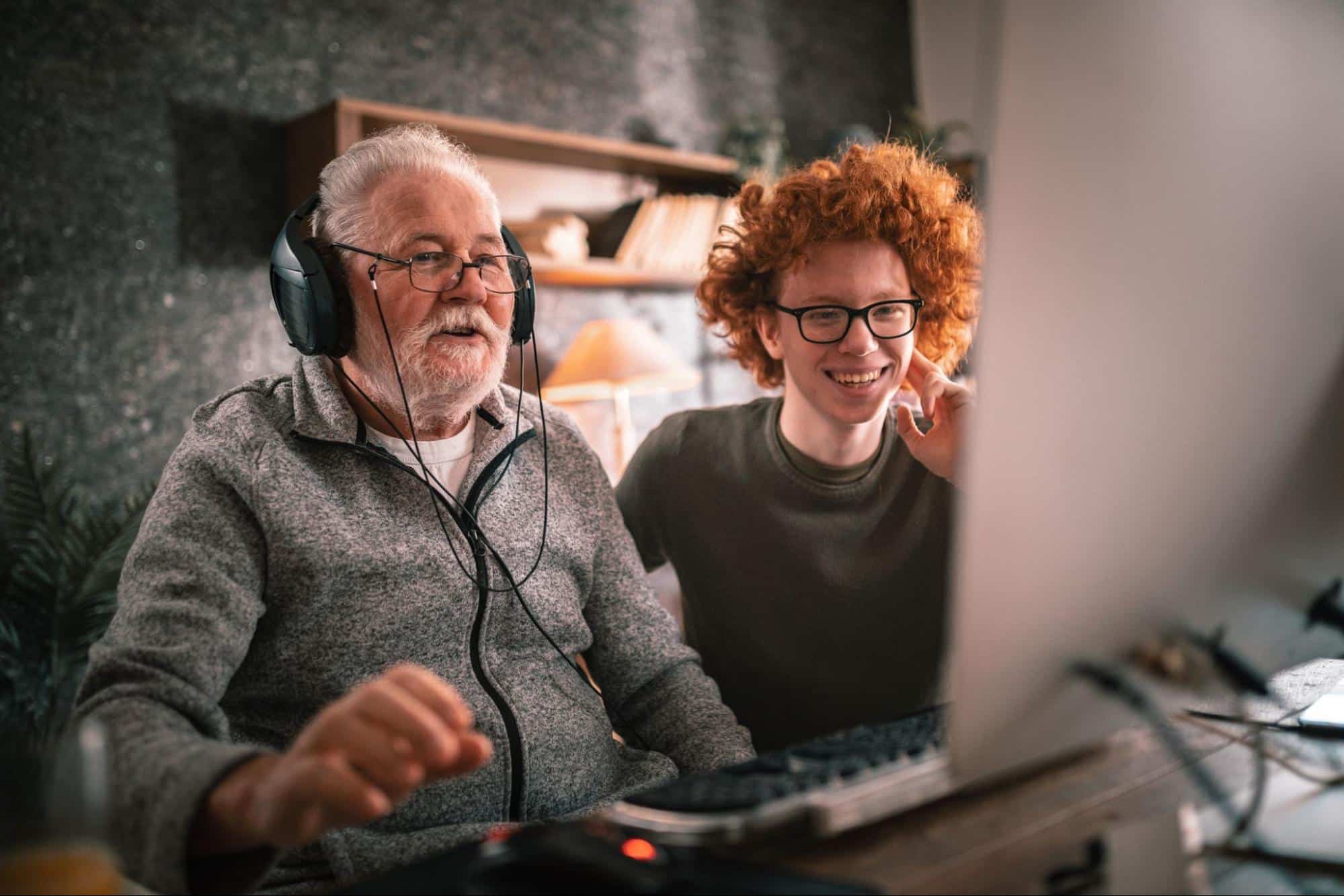 grandpa-and-grandson-using-technology-to-interact-with-younger-family-members