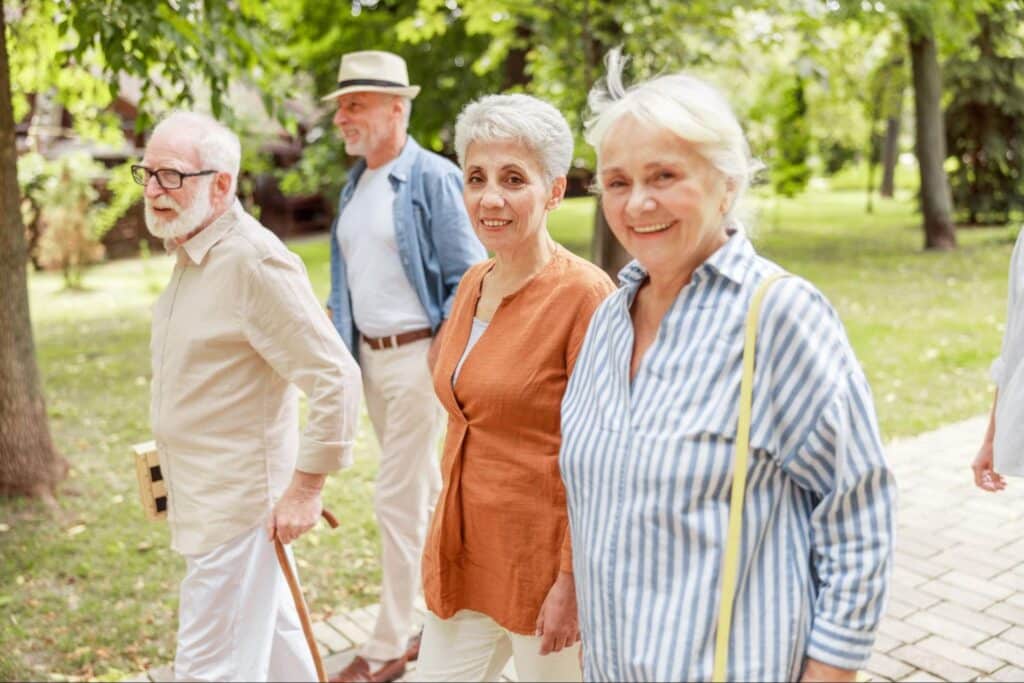 elderly-walking-group-in-park