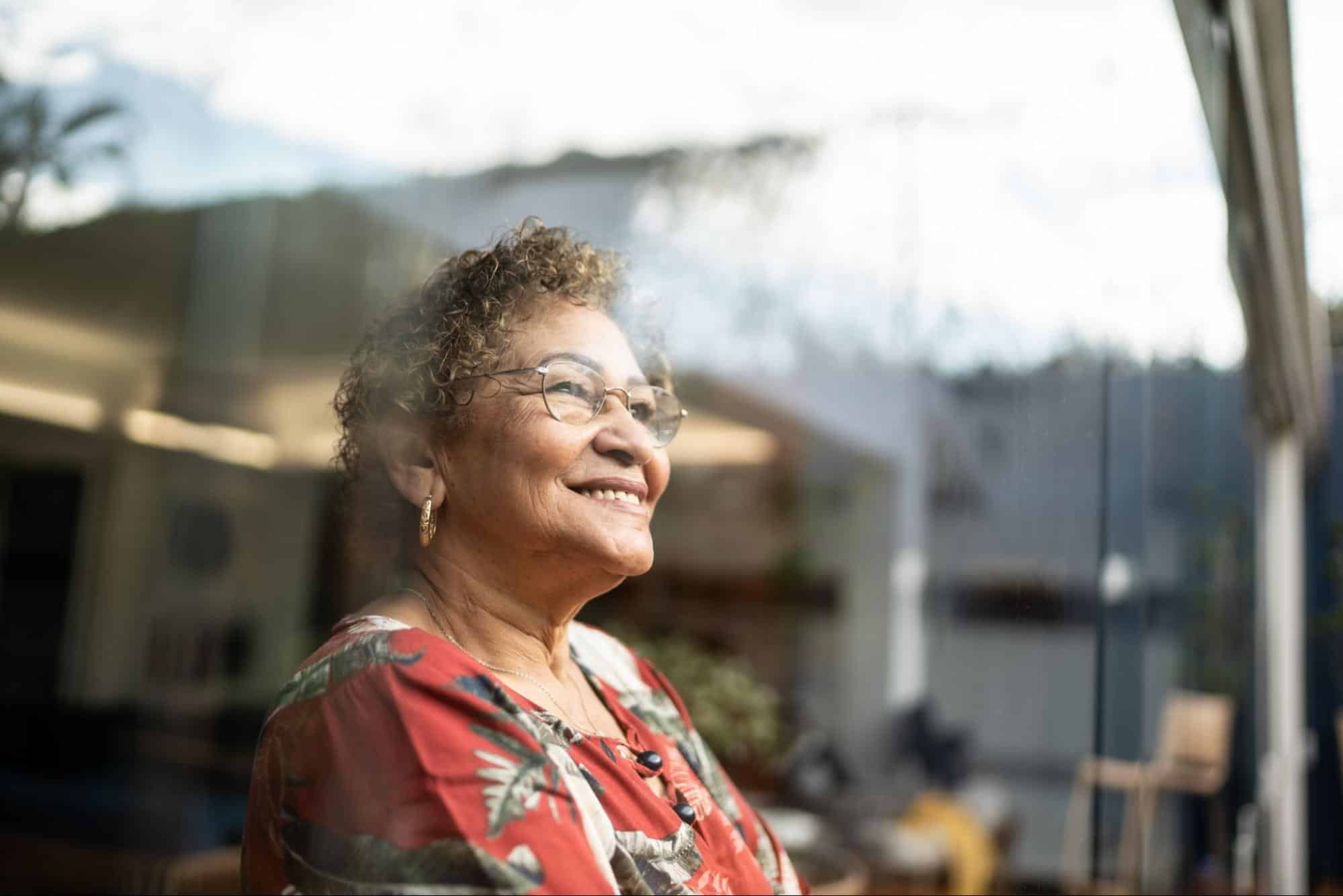 woman-looking-positive-looking out window