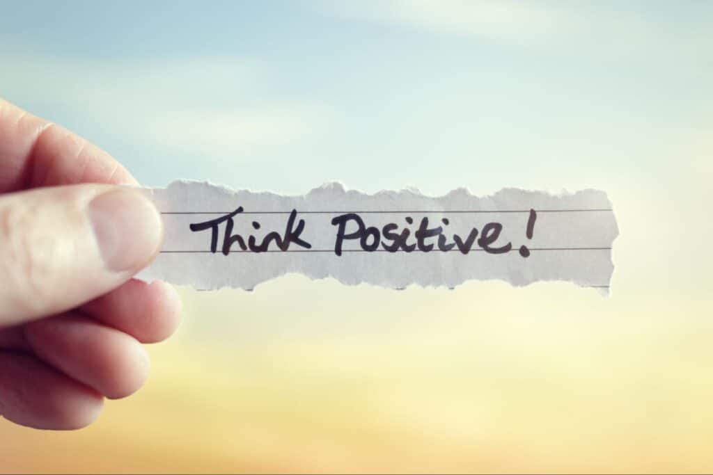 think positive written on piece of paper